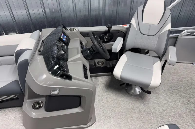 Slide: The Image of 2026 Avalon LSZ 2385 Entertainer boat interior with modern helm and captain's chair. - 9