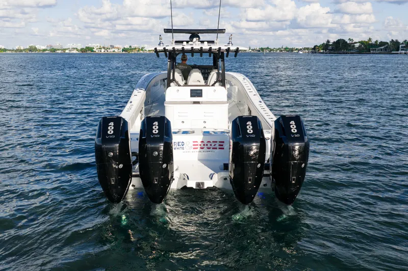 Slide: The Image of 2022 Freeman 43 boat on open water with city skyline in background. - 12