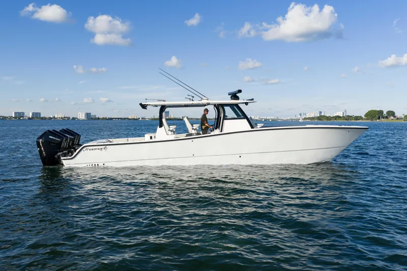 Slide: The Image of Freeman 43 boat engine compartment, 2022 model, showcasing hoses and components. - 14