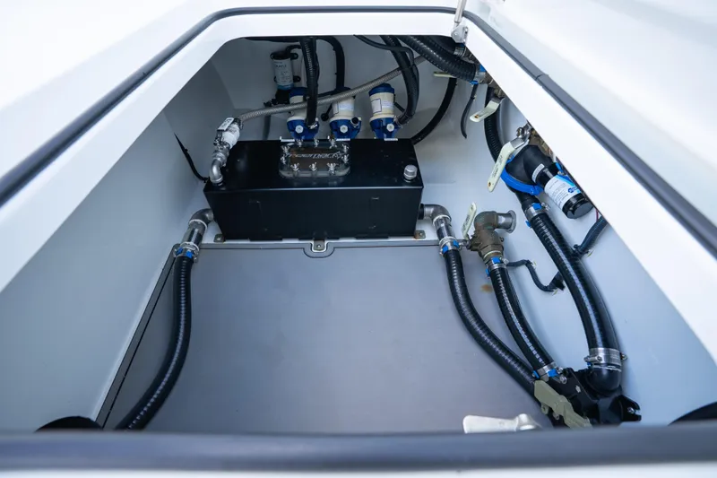 Slide: The Image of Engine compartment of a 2022 Freeman 43 boat, showcasing hoses and components. - 15