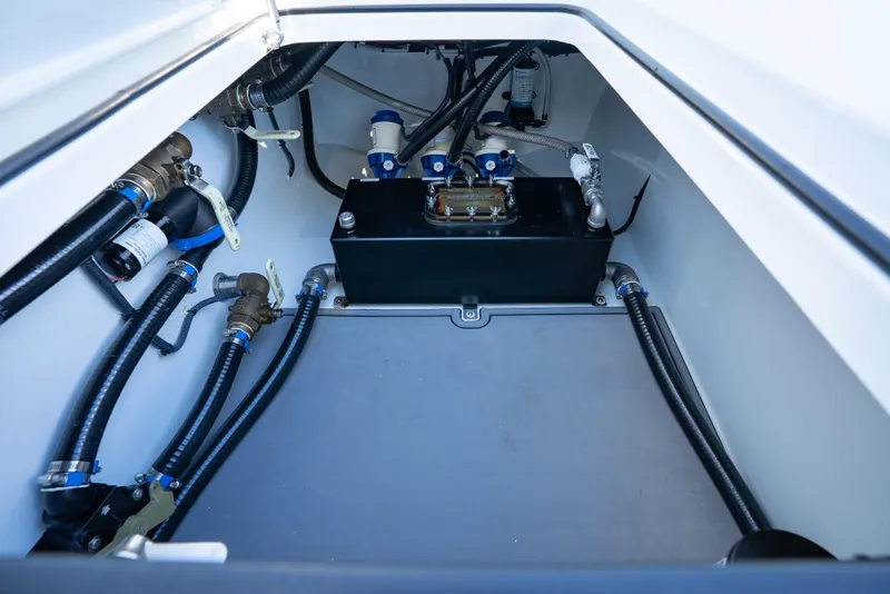 Slide: The Image of 2022 Freeman 43 boat interior with seating and rod holders, under clear blue sky. - 16