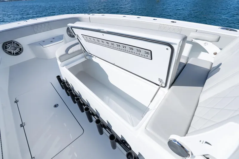 Slide: The Image of Open storage compartment on 2022 Freeman 43 boat, featuring marine equipment and ocean backdrop. - 24