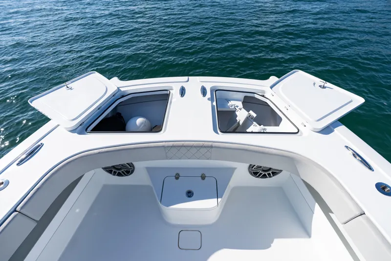 Slide: The Image of Freeman 43 boat interior with open storage compartment and speakers, 2022 model. - 27