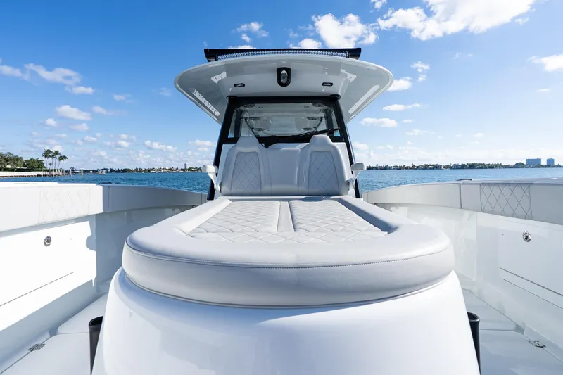 Slide: The Image of 2022 Freeman 43 boat with Garmin radar on open water under blue sky. - 30