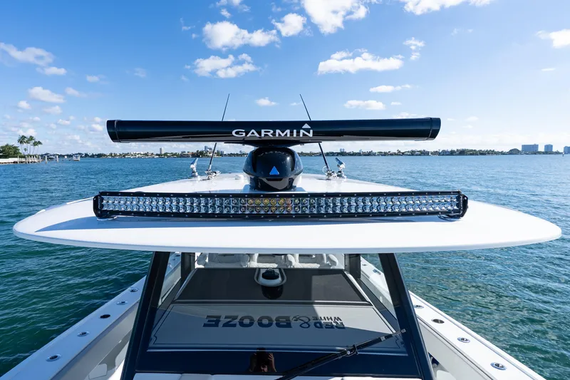 Slide: The Image of 2022 Freeman 43 boat interior with open storage compartments and cushioned seating. - 31