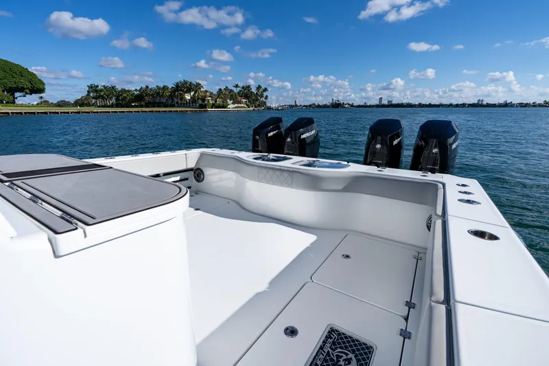 Slide: The Image of 2022 Freeman 43 boat deck with four Mercury outboard engines on a sunny day. - 33