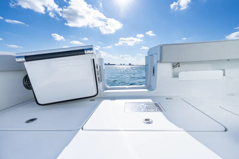 Slide: The Image of Livewell compartment on a 2022 Freeman 43 boat, featuring a blue interior. - 35