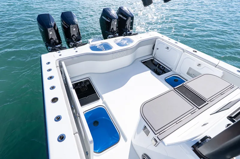 Slide: The Image of 2022 Freeman 43 boat with four Mercury engines on a calm sea. - 38