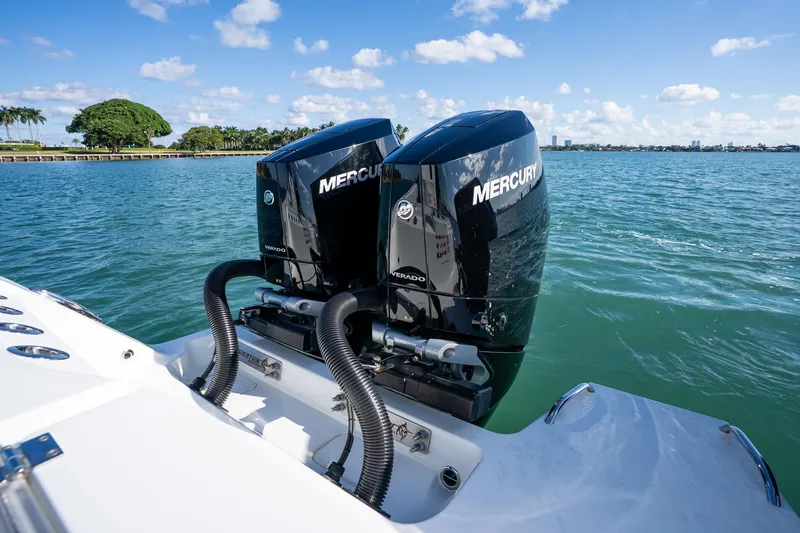 Slide: The Image of Twin Mercury Verado engines on a 2022 Freeman 43 boat, cruising on a sunny day. - 40