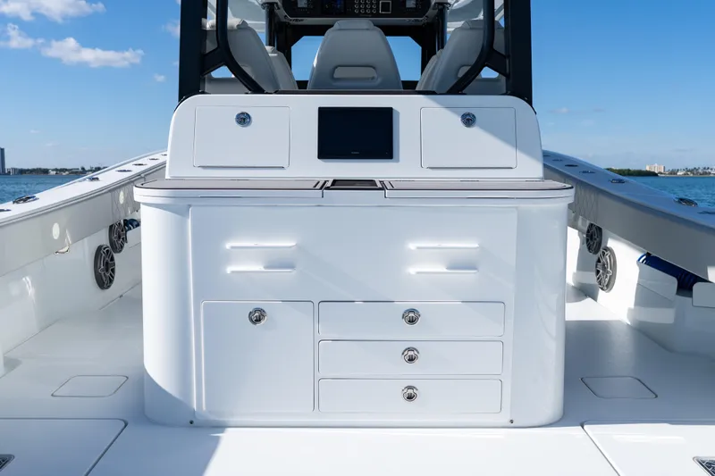 Slide: The Image of 2022 Freeman 43 boat roof with rod holders against clear blue sky. - 46