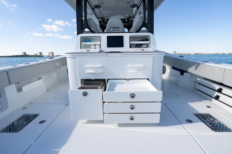 Slide: The Image of 2022 Freeman 43 boat interior with modern control panel and seating on open water. - 48