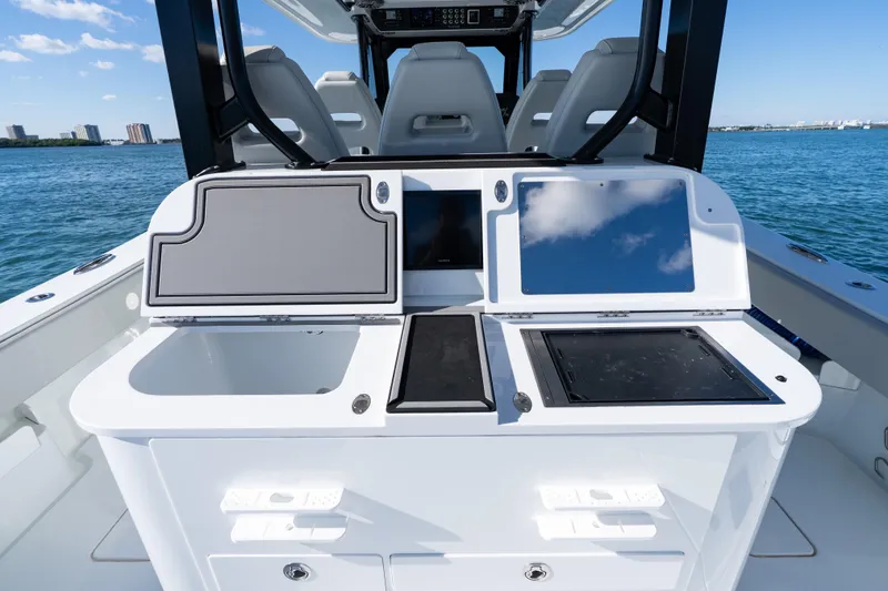 Slide: The Image of Freeman 43 boat interior, 2022 model, featuring sleek control panels and seating. - 49