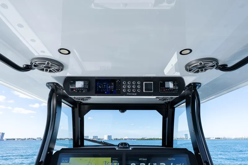 Slide: The Image of Helm of 2022 Freeman 43 boat with digital display and controls, ocean view. - 52
