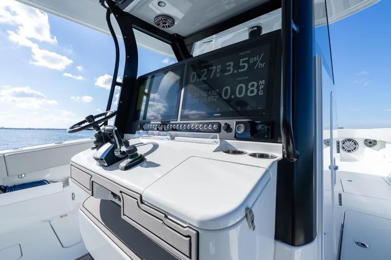 Slide: The Image of Freeman 43 boat cockpit with advanced navigation system, 2022 model, on a sunny day. - 53