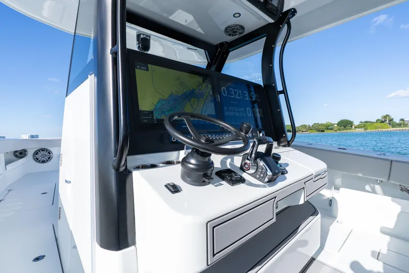 Slide: The Image of Dashboard of a 2022 Freeman 43 boat with navigation and performance displays. - 54