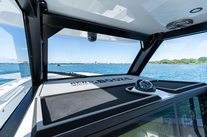 Slide: The Image of 2022 Freeman 43 boat interior with modern seating and navigation system on open water. - 56