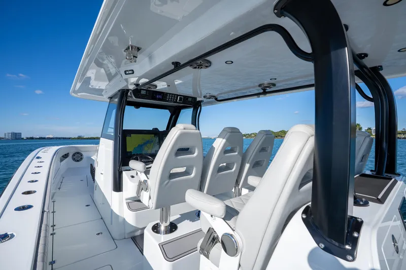 Slide: The Image of Interior view of a 2022 Freeman 43 boat with modern seating and navigation equipment. - 57