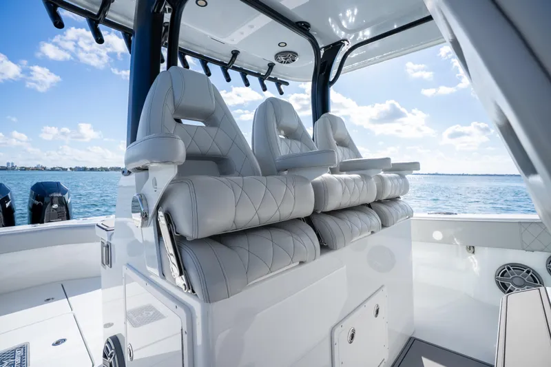 Slide: The Image of Luxurious 2022 Freeman 43 boat interior with plush seating and modern controls on open water. - 59