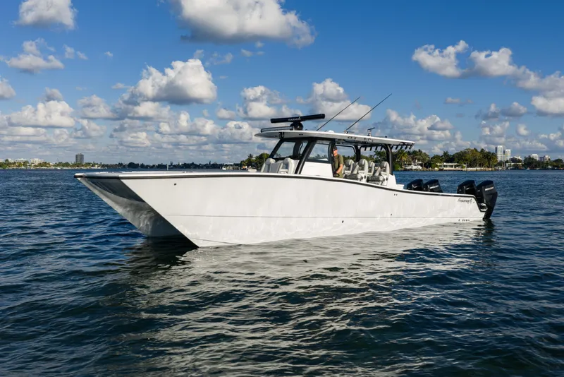 Slide: The Image of 2022 Freeman 43 boat on calm water, showcasing sleek design and modern features. - 9