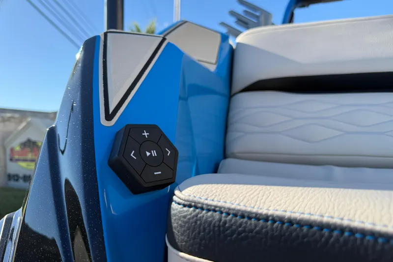 Slide: The Image of 2026 Supra SL 550 interior detail with blue and white upholstery and control panel. - 11