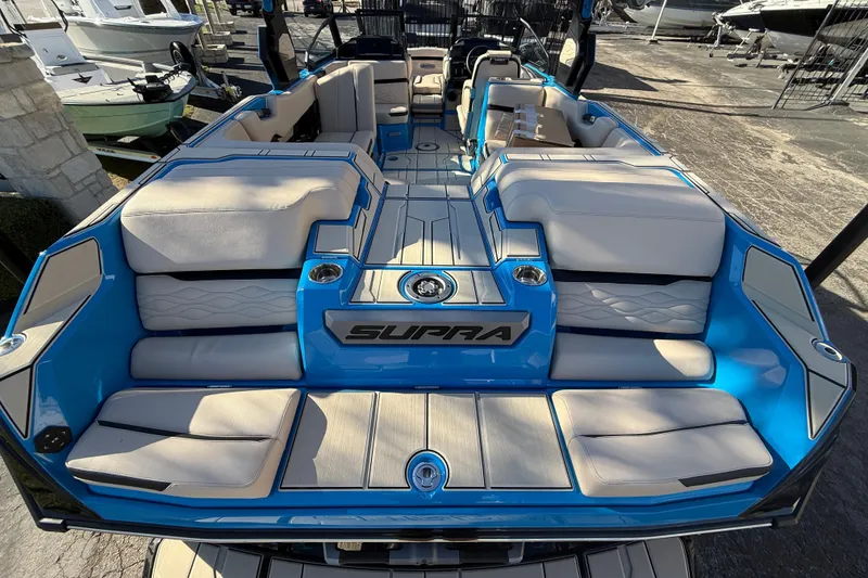 Slide: The Image of 2026 Supra SL 550 boat interior with luxurious seating and modern design. - 14