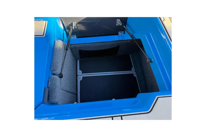 Slide: The Image of Open storage compartment in 2026 Supra SL 550, featuring blue and gray interior. - 18