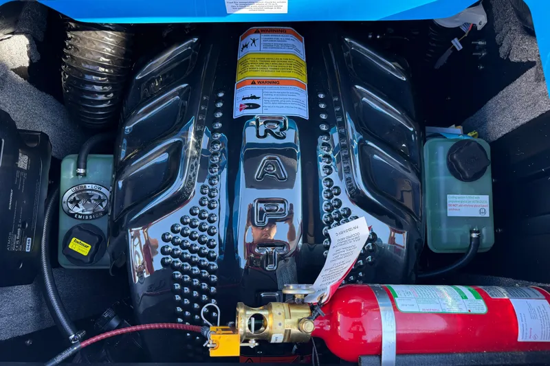 Slide: The Image of 2026 Supra SL 550 engine compartment with fire extinguisher and detailed components. - 19