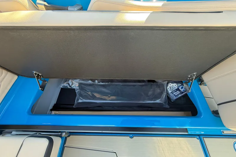 Slide: The Image of 2026 Supra SL 550 storage compartment with open lid, showcasing interior space and accessories. - 28