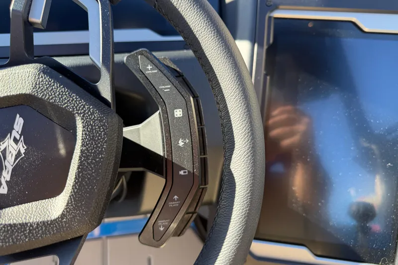Slide: The Image of 2026 Supra SL 550 steering wheel and dashboard close-up. - 42
