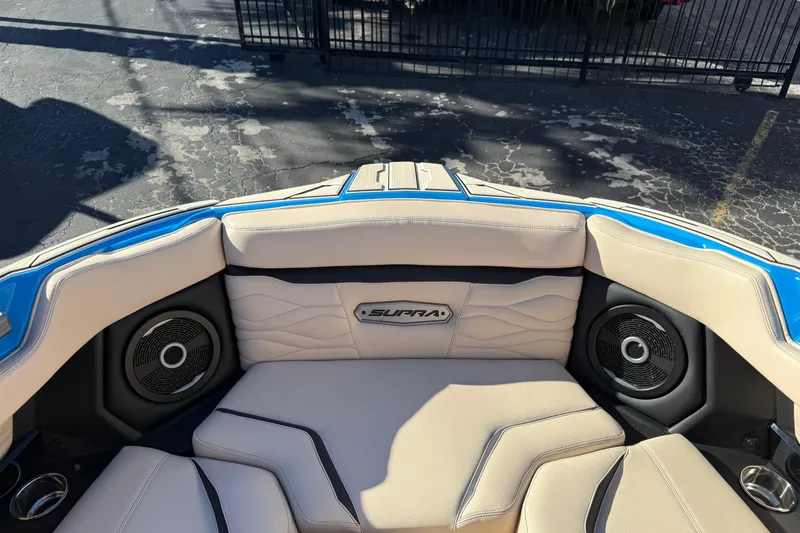 Slide: The Image of 2026 Supra SL 550 boat interior with beige seating and built-in speakers. - 50