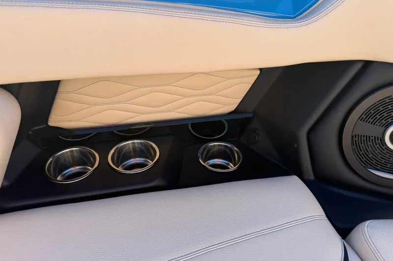 Slide: The Image of 2026 Supra SL 550 interior with beige leather, cup holders, and speaker detail. - 51