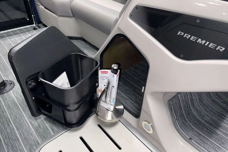 Slide: The Image of Interior of 2026 Premier 210 Sunsation RL Tritoon with storage and accessories. - 14