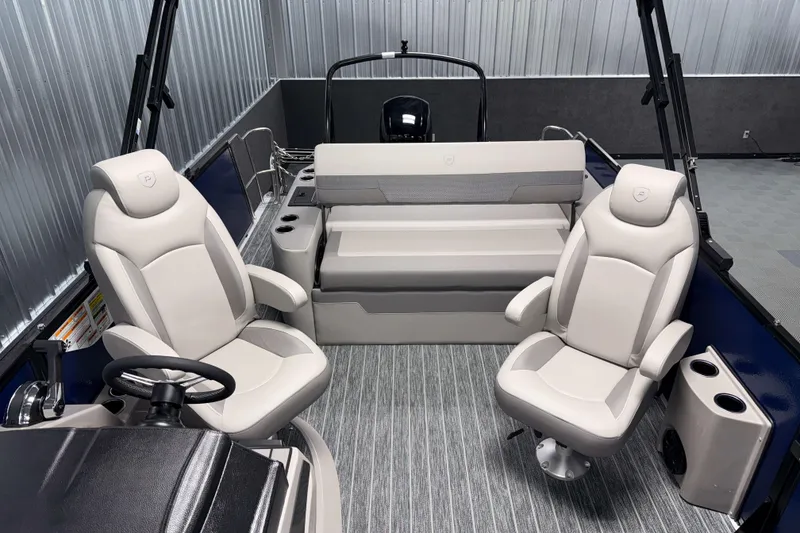 Slide: The Image of 2026 Premier 210 Sunsation RL Tritoon interior with plush seating and modern design. - 16