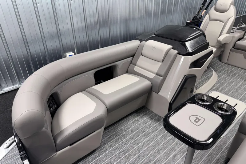 Slide: The Image of Luxurious seating area in 2026 Premier 210 Sunsation RL Tritoon boat interior. - 19