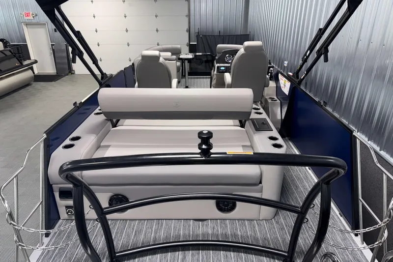 Slide: The Image of 2026 Premier 210 Sunsation RL Tritoon interior with plush seating and modern design. - 6