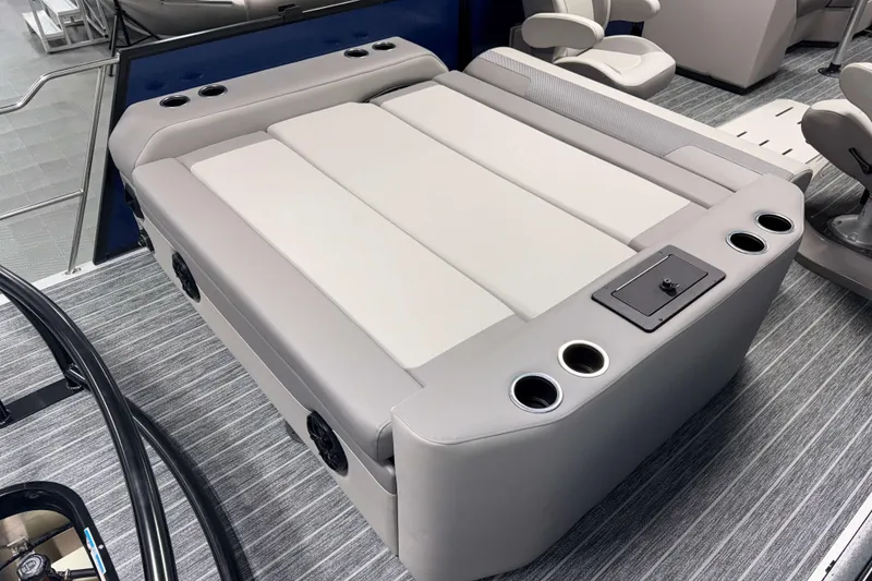 Slide: The Image of 2026 Premier 210 Sunsation RL Tritoon interior with luxurious seating and cup holders. - 9