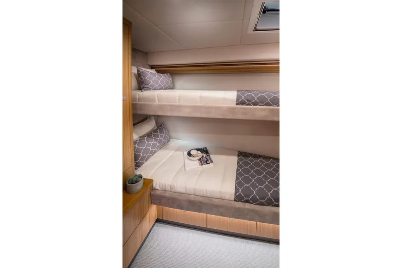 Slide: The Image of Manufacturer Provided Image: 2023 Riviera 5400 Sport Yacht interior bunk beds. - 11