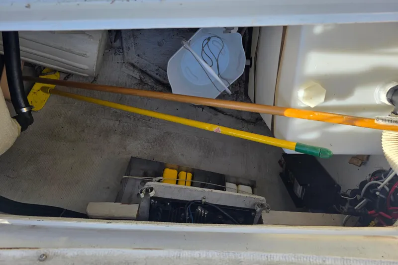 Slide: The Image of Interior view of 1985 Express Yachting Express 30, showing storage compartment and equipment. - 18