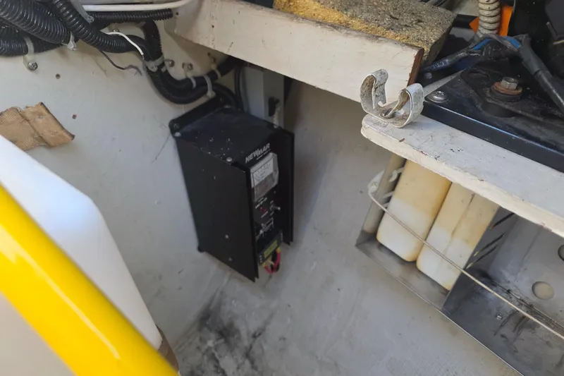 Slide: The Image of Electrical compartment of 1985 Express Yachting Express 30, featuring wiring and components. - 19