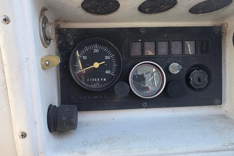 Slide: The Image of Control panel of a 1985 Express Yachting Express 30 with Yanmar gauges. - 24