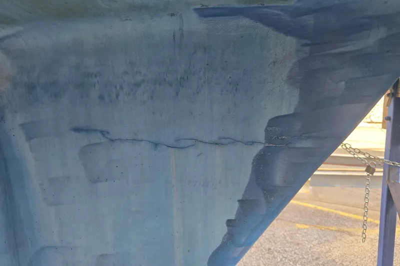 Slide: The Image of Close-up of a crack on the hull of a 1985 Express Yachting Express 30. - 34