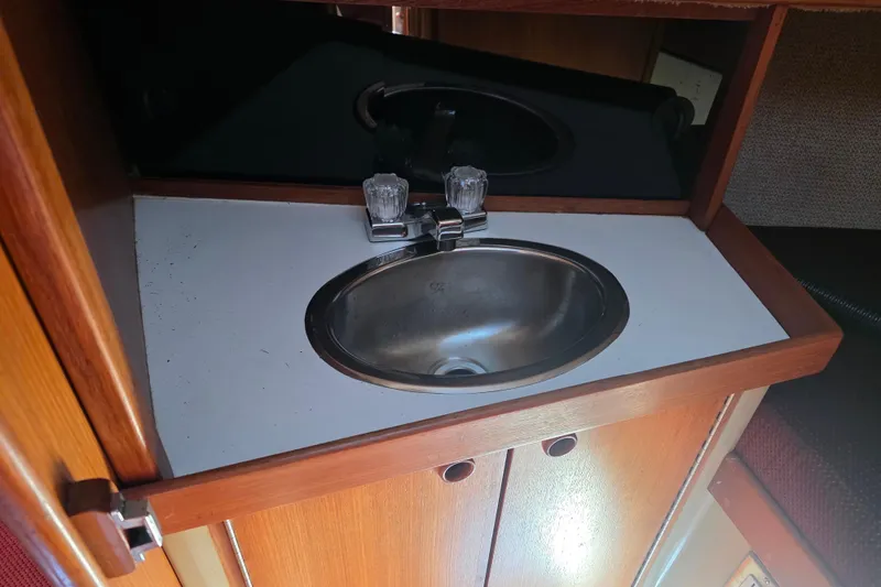 Slide: The Image of Stainless steel sink in 1985 Express Yachting Express 30 yacht interior. - 38
