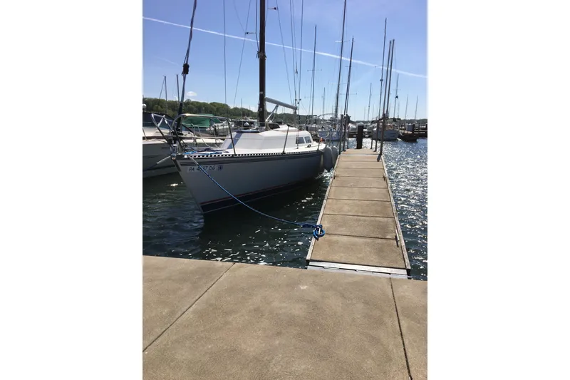 Slide: The Image of 1985 Express Yachting Express 30 sailboat docked at marina on a sunny day. - 40