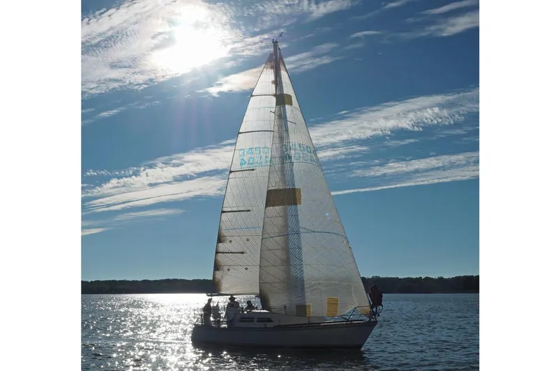 Slide: The Image of 1985 Express Yachting Express 30 sailboat on a sunny day with clear skies. - 42