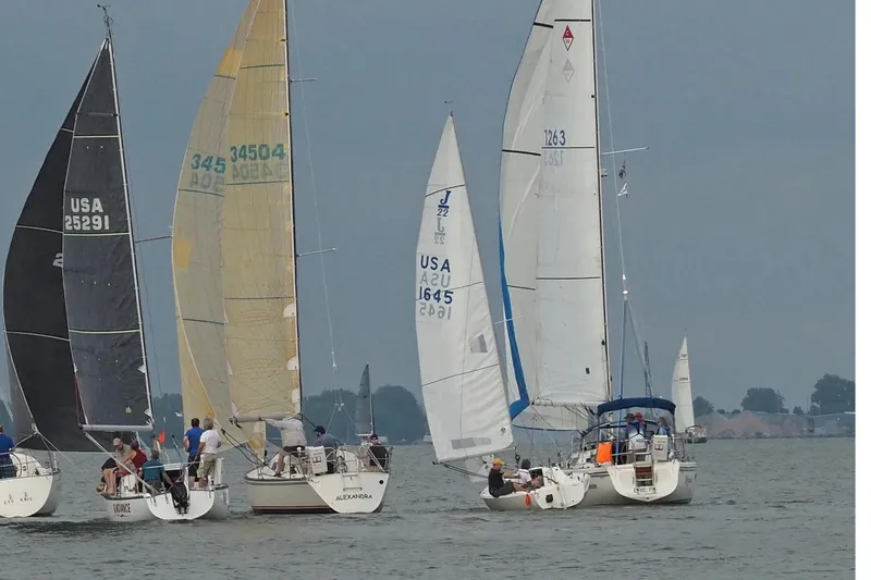 Slide: The Image of Sailboats racing on a lake, featuring a 1985 Express Yachting Express 30. - 45