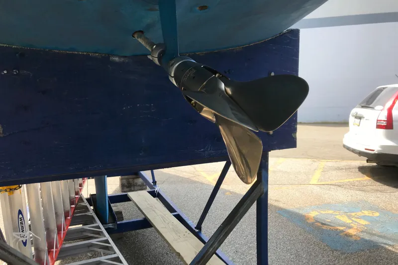 Slide: The Image of Propeller of 1985 Express Yachting Express 30 on a stand, outdoor setting. - 47