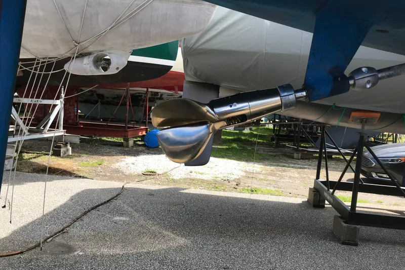 Slide: The Image of 1985 Express Yachting Express 30 yacht propeller and rudder in a boatyard. - 48