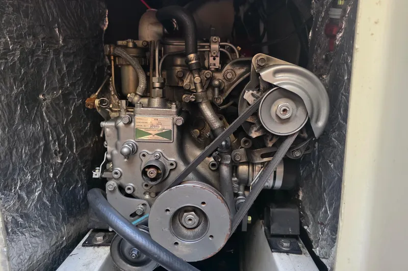 Slide: The Image of Engine of 1985 Express Yachting Express 30, detailed view with belts and components. - 5