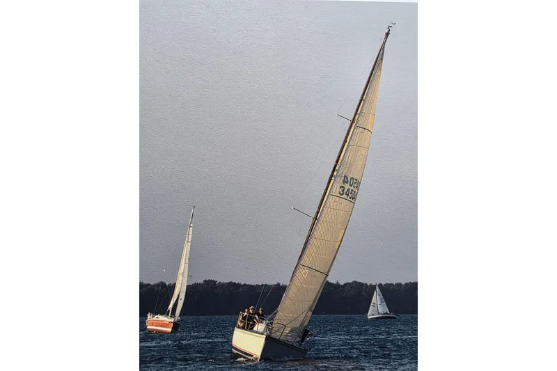 Slide: The Image of Sailboats on water, featuring 1985 Express Yachting Express 30 model. - 52