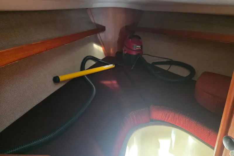 Slide: The Image of Interior cabin of 1985 Express Yachting Express 30 with cleaning equipment. - 7